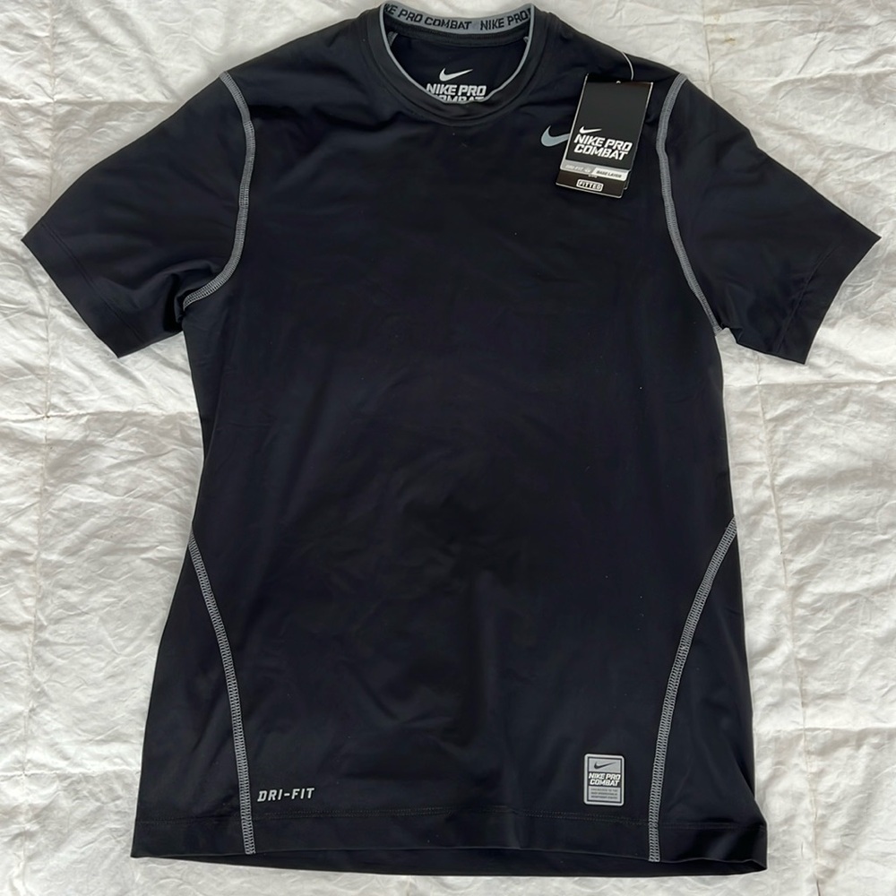 New with tags, Nike Pro Combat, fitted compression shirt.